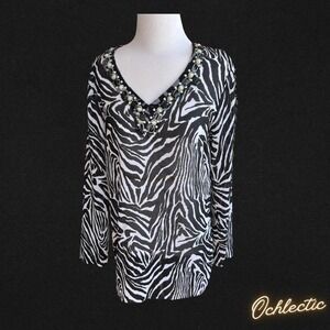Black and white zebra print long sleeve blouse with beaded neckline